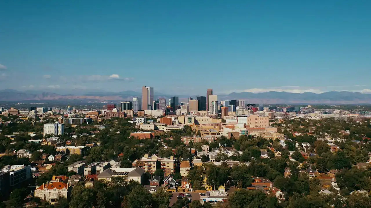 Denver skyline with the Front Range mountains behind it